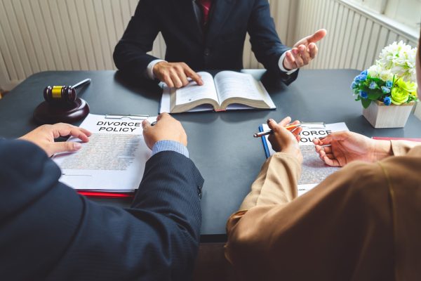 The couple consulting a lawyer about agreement on the divorce.